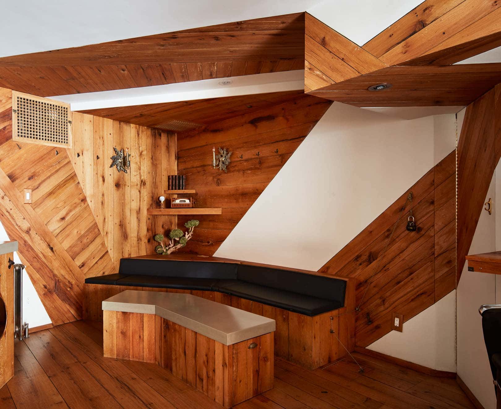 Client waiting area at The Kinsman, a West Village barber shop in Manhattan NYC offering haircut, beard trim and skin fade services.